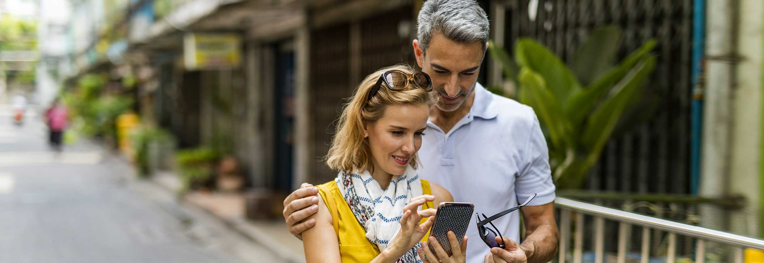 Couple using online banking features on phone