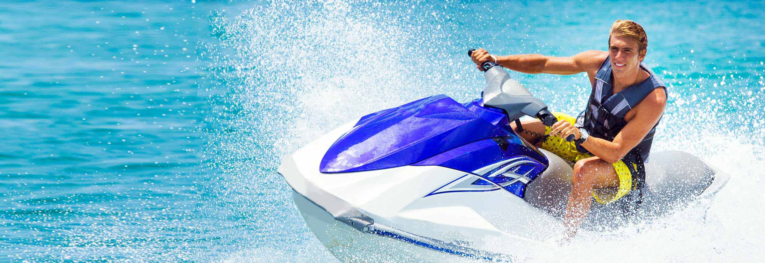 Person riding a jetski on the water.