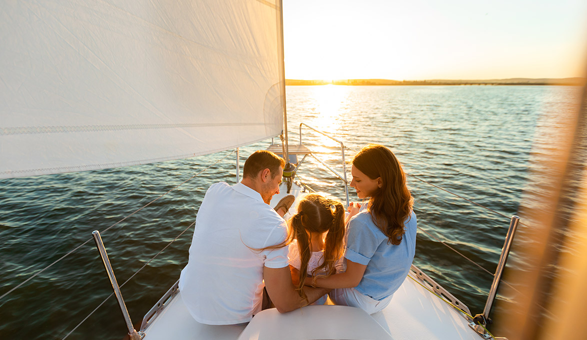 family enjoying vacation on a new sailboat