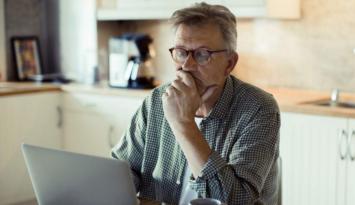 man reviewing financial records and deleting outdated documents