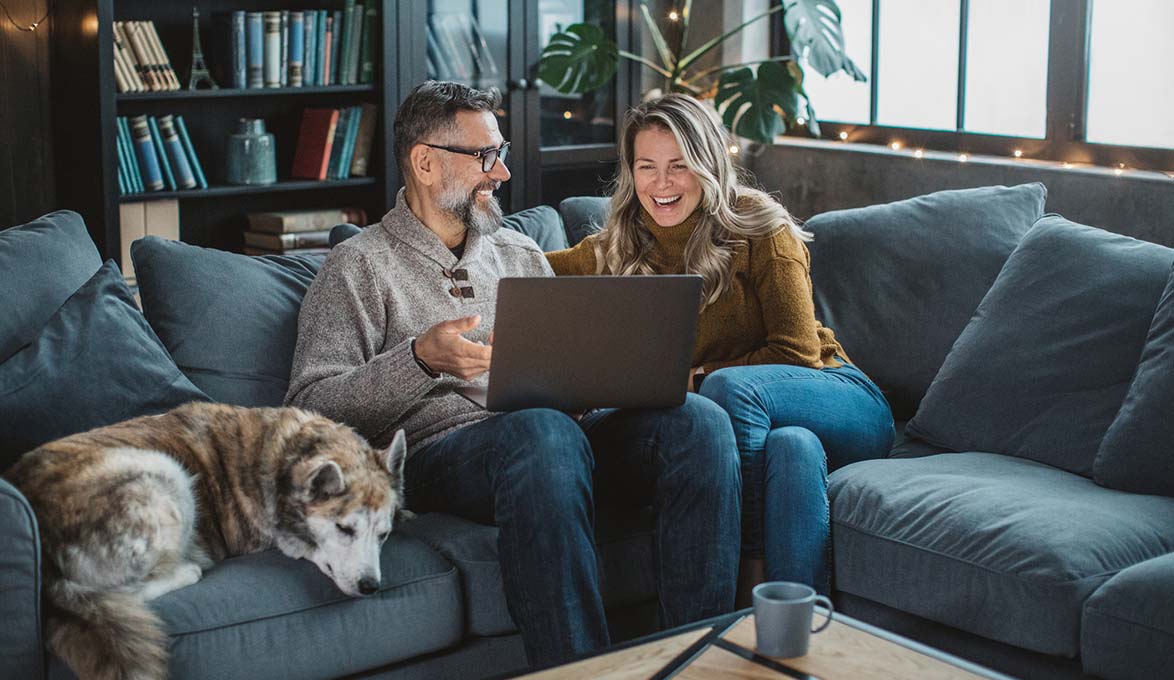 couple at home seeing if they are financially ready for retirement