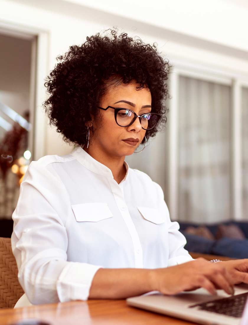 woman reviewing her firewalll settings to keep accounts secure