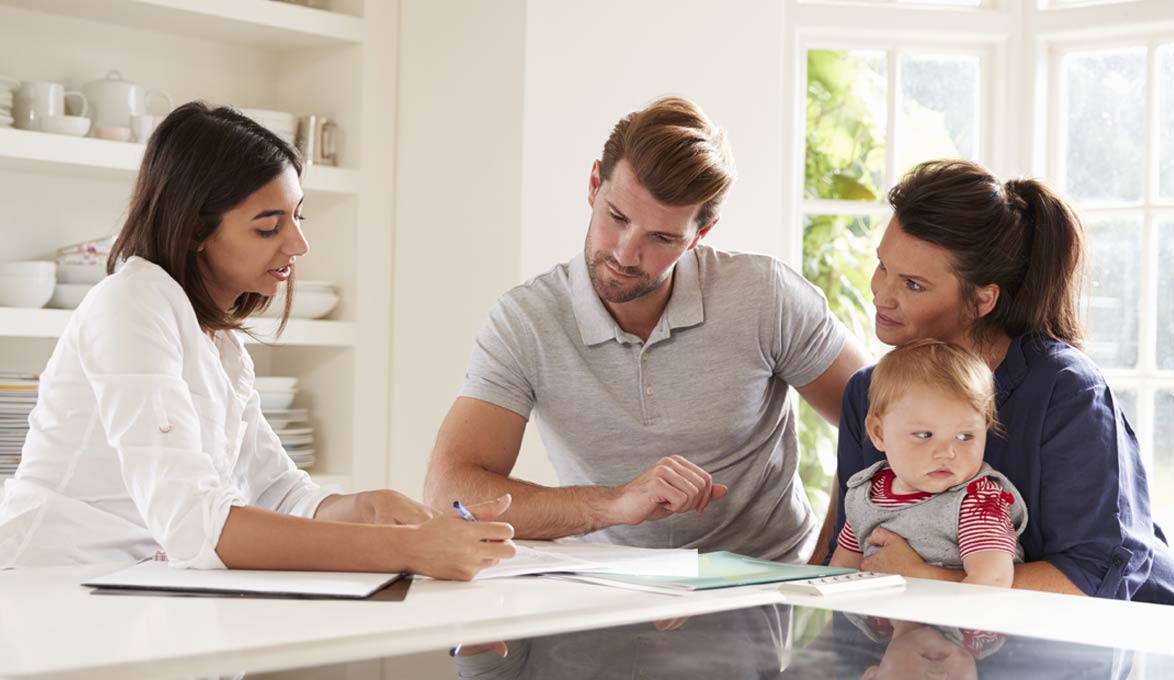 couple with financial advisor learning about year end tax tips